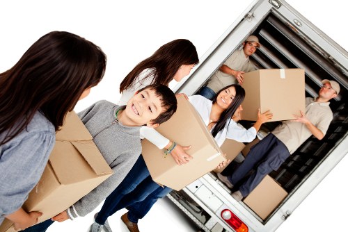 Removal company team handling house move in Lambeth