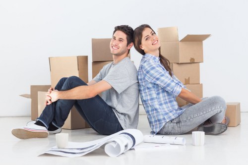 Commercial moving team transporting business furniture in Lambeth