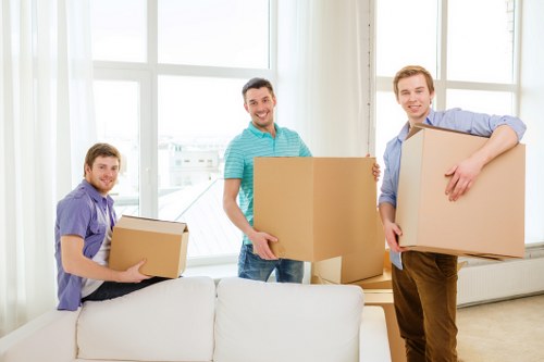Professional movers handling furniture in a Lambeth property