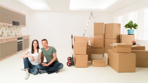 Professional removals team handling furniture in Lambeth