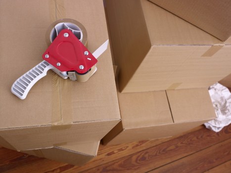 Careful packing and wrapping of household furniture for transport