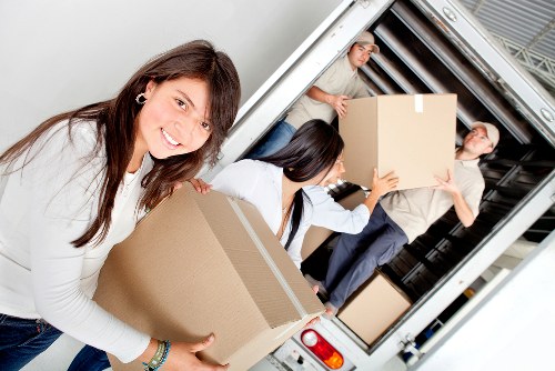 Removal specialists handling furniture during a Lambeth relocation