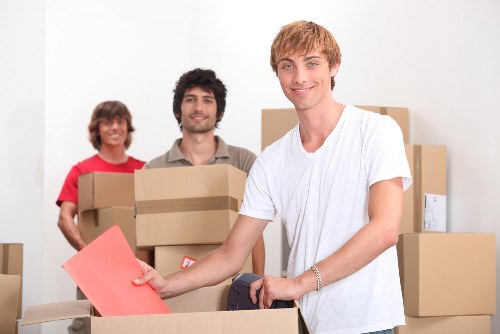 Removal team organizing items for transport in Lambeth